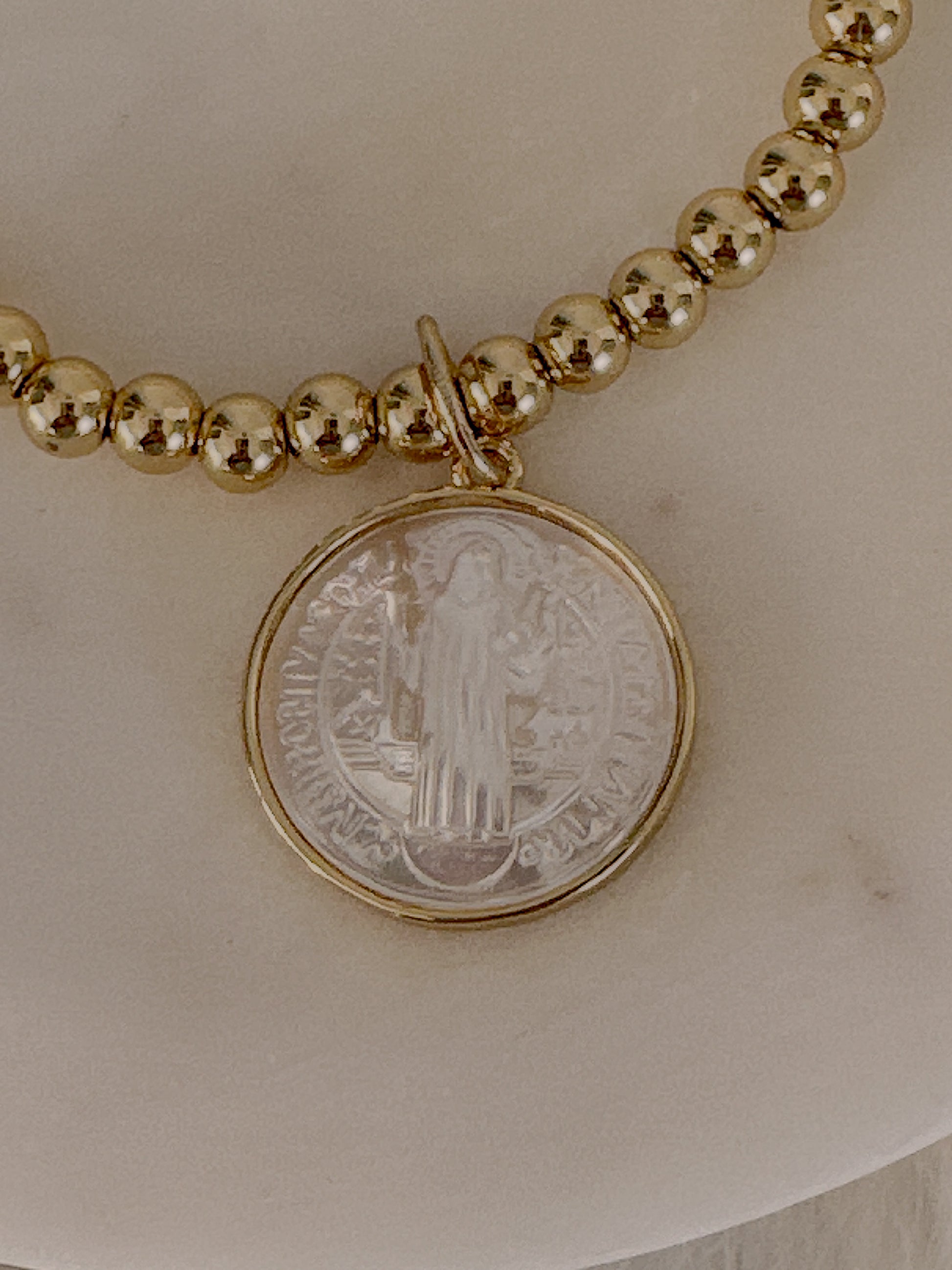 St. Benito mother of pearl beaded stretch bracelet - Adorn U